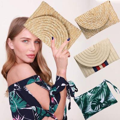 China JAKIJAYI Women Summer Mini Handbag Money Clutch Wallet Portable Latch Envelope Woven Straw Clutch Bags for sale