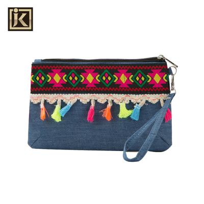 China JAKIJAYI Portable Women's Clutches Straw Tassel Zipper Clutch Purse National Charming Handbag for Shopping for sale