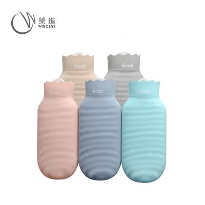 China Rubber Portable Hot Water Bottle Silicone Hand Warmer Reusable Hot Water Bag With Knitted Sleeve for sale