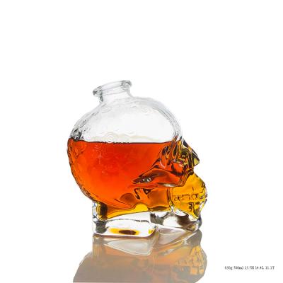 China Fancy Shape Spirit Beverage Design Unique Glass Bottle 700ml Skull Bottle for sale