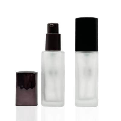 China 30ml Cosmetic Pump Bottles Frosted Base Bottle Cosmetic Glass Square Shape for sale