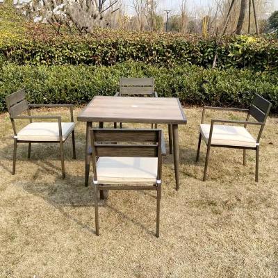 China Modern Poly Rattan Furniture Backyard Dining Table Cafe Chair Park Garden Steel Five Piece Set for sale