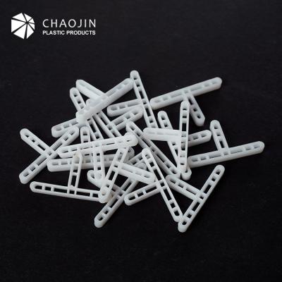 China Long Ceramic Tile Solid Spacer Leg Solid Ceramic Tile Spacer for sale