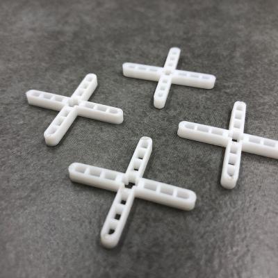 China Thin And Short Ceramic Tile Leg Spacer Solid Border Ceramic Tile Spacer for sale