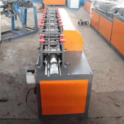 China Metal Shutter Door Roll Forming Machine 0.3 - 0.6 Mm Raw Material Thickness for sale