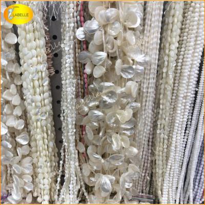 China 100% Natural Color As Per Photo Natural White Shell Luster Round Shell Pearl Beads Volume for sale