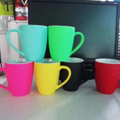 China 350ml Viable Soft Touch Fluorescence Shape Belly Finish Colored Ceramic Mug for sale