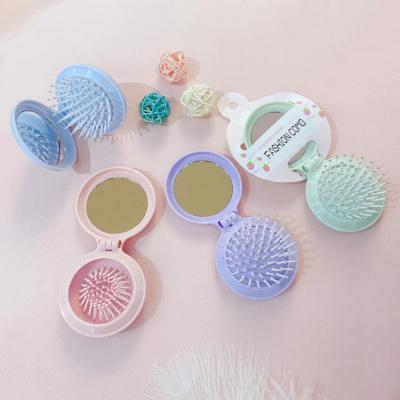 China Custom Logo Wet Pocket Detangle Foldable Mini Folding Hair Brush With Foldable Makeup Mirror for Travel Folda Feature for sale