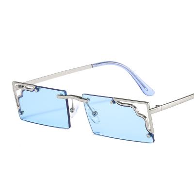 China 15 Years Experience New Small Square High-end Rimless Transparent Fashion Cavity Glass Casual Sunglasses for sale