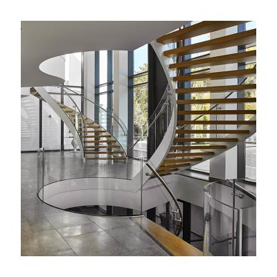 China Modern Indoor Stainless Steel Baluster Railing Design Glass Fencing Wooden Stairs Treads Curved Staircase for sale