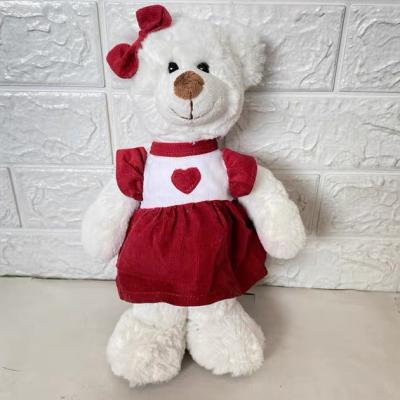 China Custom white stuffed plush teddy bear valentine gift for girls promotional cute plush teddy bear with red dress for sale