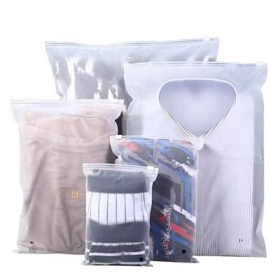 China Custom New Design Safety Matte Frosted Plastic Zipper Bags T-shirt Packaging Zipper Lock Clothing Bags for sale