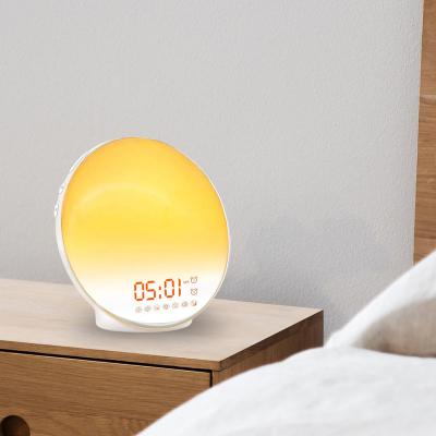 China Radio Smart LED Wake Up Light Colorful Atmosphere Sunrise Light Bedside Wake Up Alarm Clock Night Light for sale