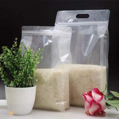 China 1kg/700g Flat Bottom Pouch Glossy Barrier Printing Transparent Rice Packaging Bag With Window for sale