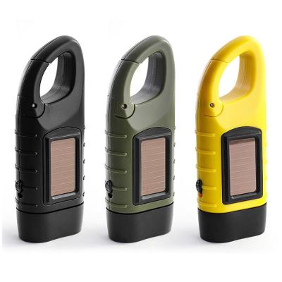 China Camping/Hiking New Hand Crank Operated Outdoor Self-Defense Led Mini Flashlight Strong Light Multifunctional Portable Solar Rechargeable Lamp for sale