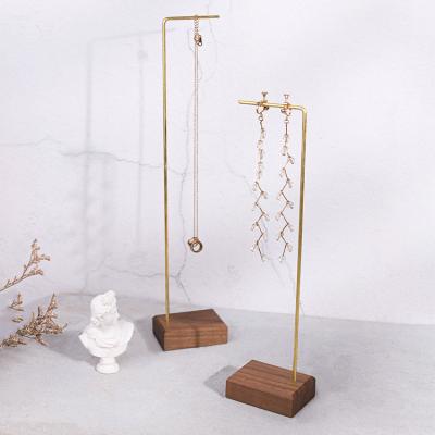 China Display Devices Metal Wire Jewelry Display Stand With Stone Wood Base And Gold Finishing for sale