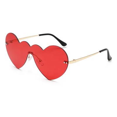 China Fashion Sunglasses Fashion UV400 Cute One Piece Part Sunglass Plastic Candy Colors Heart Sunglasses For Women Girls Ladies for sale