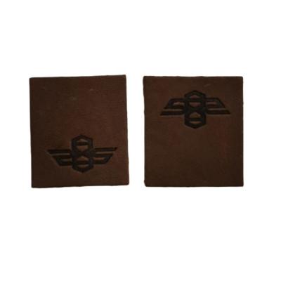 China Viable Customize Embossed Leather Patches Sew On Shirt Apparel Neck Logo Tag for sale