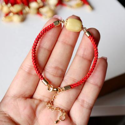 China Natural Simple White Nectar Amber Red Hand Rope Retro Bracelet CLASSIC For Baby Kid Women for sale