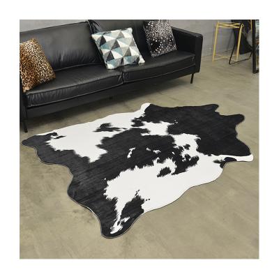 China Small Black And White Cowhide Faux Plush Cow Print Non-Slip Cute Fun Blanket Nice Rug For Decorating Kids Room for sale