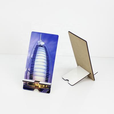 China Design Your Own Photo Lancoda 7 Types Customized Sublimation MDF Cell Phone Stand Wooden Photo Holder for sale