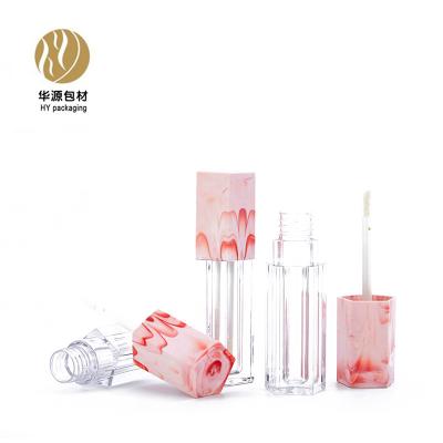 China Cosmetics ABS plastic lip gloss tube pentagon lip gloss tube air duct red marbling packaging material for sale