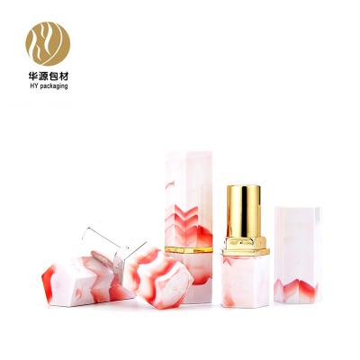 China New personal care lipstick tube cosmetics red marbling pentagonal packaging material for sale