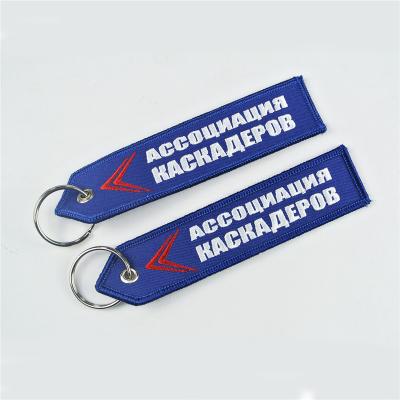 China Cloth Embroidery Customized Double Sided Cloth Flying Key Chains Key Ring Key Tag for sale