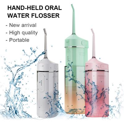 China Newest Outdoor Handheld Oral Irrigator With 3 Fashion Clean Teeth Cleaning Kit Portable Foldable Electric Cordless Water Flosser for sale