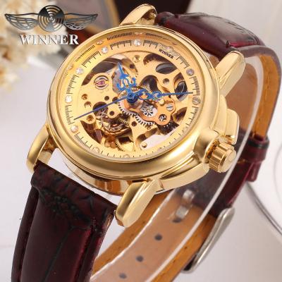 China Gift Luxury Brand Power Reserve Winner Women Golden Skeleton Watches Relojes Mujer With Brown Leather for sale