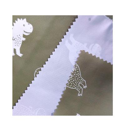 China Factory Direct Sales 100% Custom Nice Waterproof Polyester Dinosaur Pattern Double Sided Printed Fabric for sale