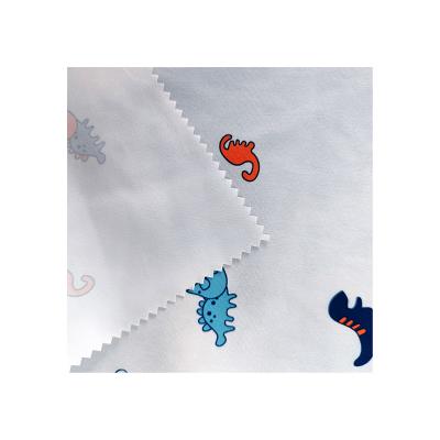 China 100% Polyester Cartoon Dinosaur Waterproof Heavy Wholesale Pattern Printed Fabric for sale