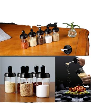 China China Manufacturer Sustainable Wholesale Airtight Round Glass Spice Storage Jar With Black Lid And Spoon for sale