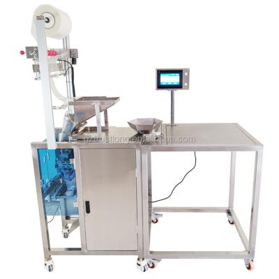 China Hand Put Feeding Hand Feeding Automatic Small Scale Put Weighing Packing Machine For Irregular Mixed Combination Products High Precision for sale