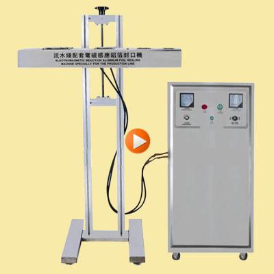 China Automatic Food Electromagnetic Induction Aluminum Foil Sealer Sealing Machine for sale