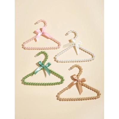 China Plastic Fashion Pearl Plastic Bow Clothes Clothes Hanger For Kids Children Dog Cat Dropshipping for sale