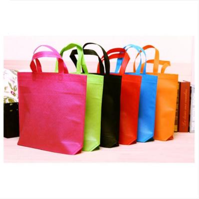 China Recycled Materials Custom Bags Recyclable Non Woven Loop Handle Non Woven Fabric Bags for sale