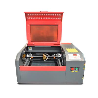 China Water-cooled Factory Direct Supply Co2 Laser Engraving Machine 4040 Model On Printing Wood for sale