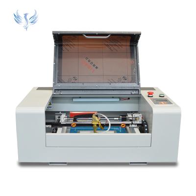 China Water-cooled Hot Co2 Laser High Speed 40w 50w 60w Laser Engraving Machine For Wood for sale