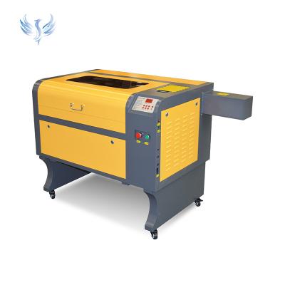 China Water-cooled Long Lifetime Co2 Laser Engraving Machine 6040 Model For Engraving Wooden for sale