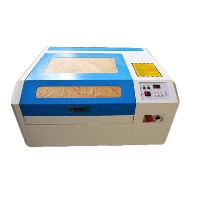 China Water-cooled 50w 60w laser co2 4040 laser engraving machine for glass bottle with rotary mini laser cutting machine price for sale