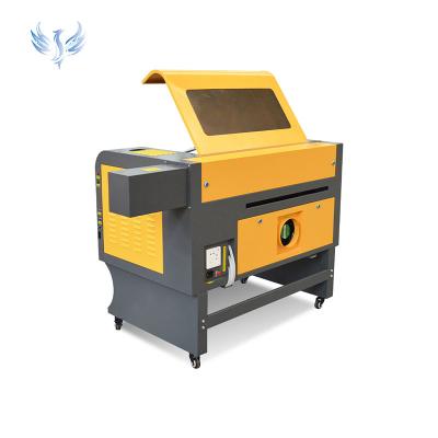 China Water-cooled 50W/60W/80W/100W CO2 Laser Wood Acrylic CNC Laser Cutting / Engraving Machine Price for sale