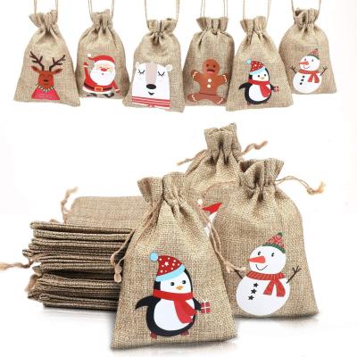 China Eco Friendly AZO Free Christmas Drawstring Candy Treat Burlap Burlap Gift Bags With Snowman Printed for sale