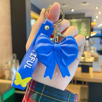 China Wholesale 3D Rubber Bowknot 3D Doll Bow Fashion PVC Keychains Gift Key Chain Promotional Blue Pendant Keychains With Wristband Girl Gift Keyring for sale