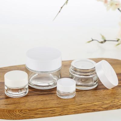 China Stock Luxury Cosmetic Packaging Containers Eco-Friend Glass Lead Free Jars 50g 100g Clear Cosmetic Packaging for sale