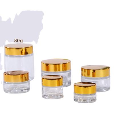 China Lead Free Skin Care Bottle Jars 50g 100g 4oz Body Cream Cosmetic Glass Facial Airless Glass Jar With Gold Lid for sale