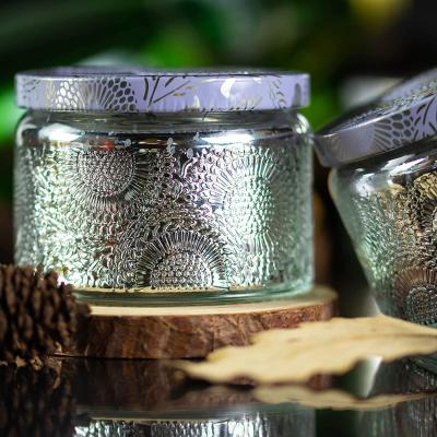 China Lead Free 4 ozEmbossed Shiny Silver Glass Candle Container With Tin Lid And Labels for sale