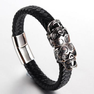 China Vintage 316l Stainless Steel Macrame Mens Gold Skull Leather Bracelet for sale