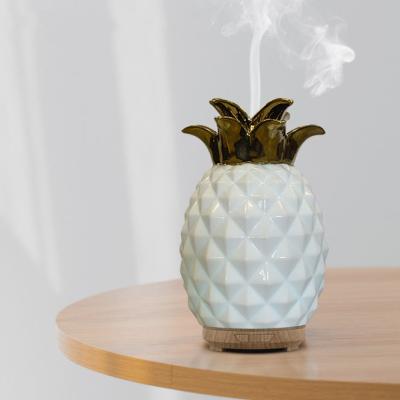 China Car Pineapple Shaped Ceramic Aroma Diffuser Essential Oil Air Humidifier 120ml for sale