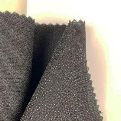 China 1.5m*100m xingyan elastic 150d woven interlining roll polyester fabric for lady's garments and garments for sale